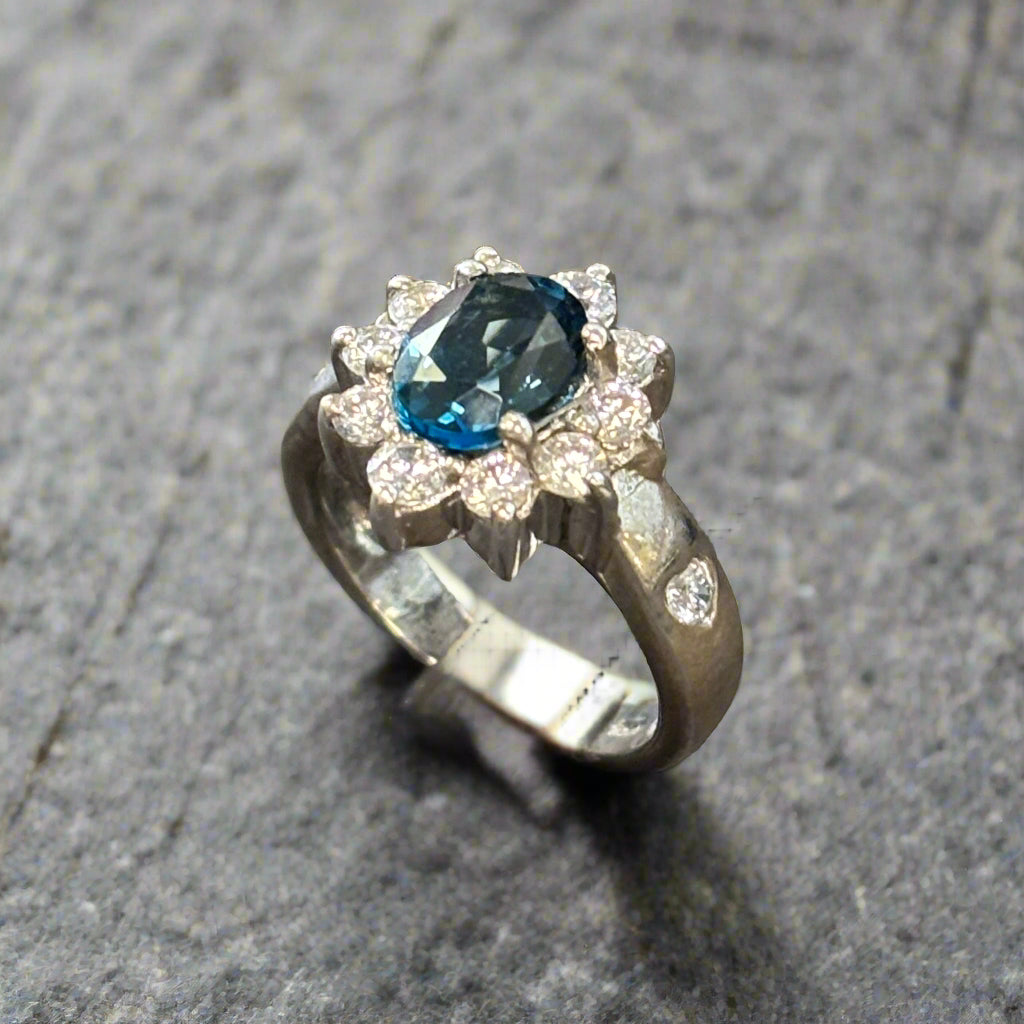 Estate Blue Topaz 8x6mm and CZ Ring set in Sterling Silver, 4.5gr.