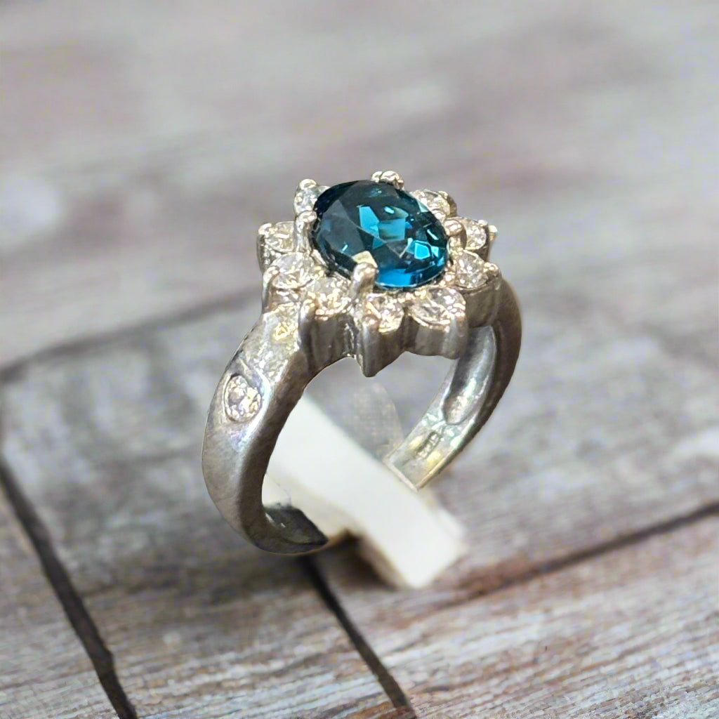 Estate Blue Topaz 8x6mm and CZ Ring set in Sterling Silver, 4.5gr.