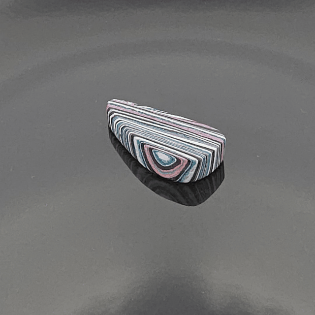 Funkrite Free From Cabocheon “Fordite” Galveston, TX, 36x17x7mm, 22.50ct - Highly Fluorescent