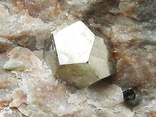 This is a cool iridescent Pyrite dodecahedron crystal! Want to learn how it formed?
