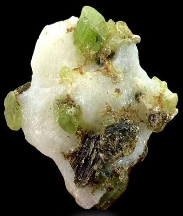 What is a Fully Terminated Green Diopside Crystal On Matrix? What are they and how do they form?