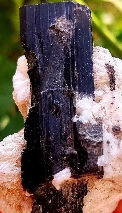 What's Black Tourmaline and what forms it? What is its historical significance?