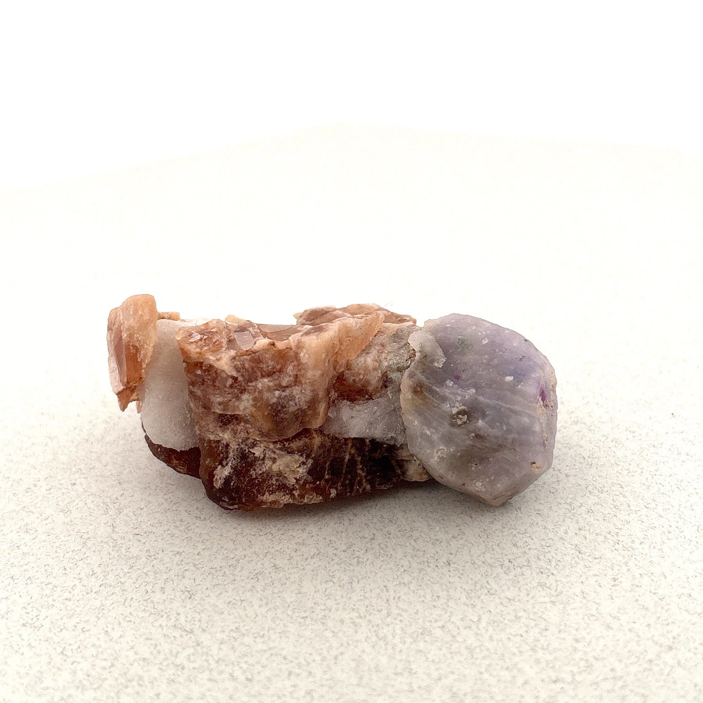 Fluorescent Hackmanite & Calcite on Quartz, 46.69gr, 53x35x23mm