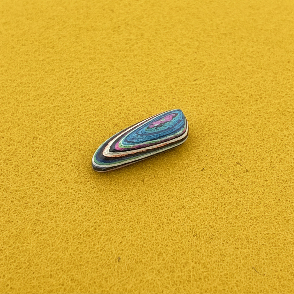 Funkrite Free From Cabocheon “Fordite” Galveston, TX, 29x15x8mm, 14.43ct - Highly Fluorescent