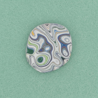 Heil Garbage Truck Fordite Free Form Caboceon, Heil (Milwaukee, WI) 28x25x3mm, 13.88ct
