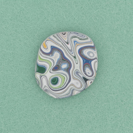 Heil Garbage Truck Fordite Free Form Caboceon, Heil (Milwaukee, WI) 28x25x3mm, 13.88ct