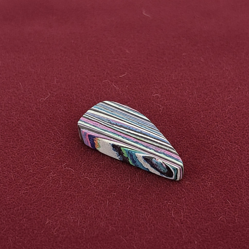 Funkrite Free From Cabocheon “Fordite” Galveston, TX, 36x17x7mm, 22.50ct - Highly Fluorescent