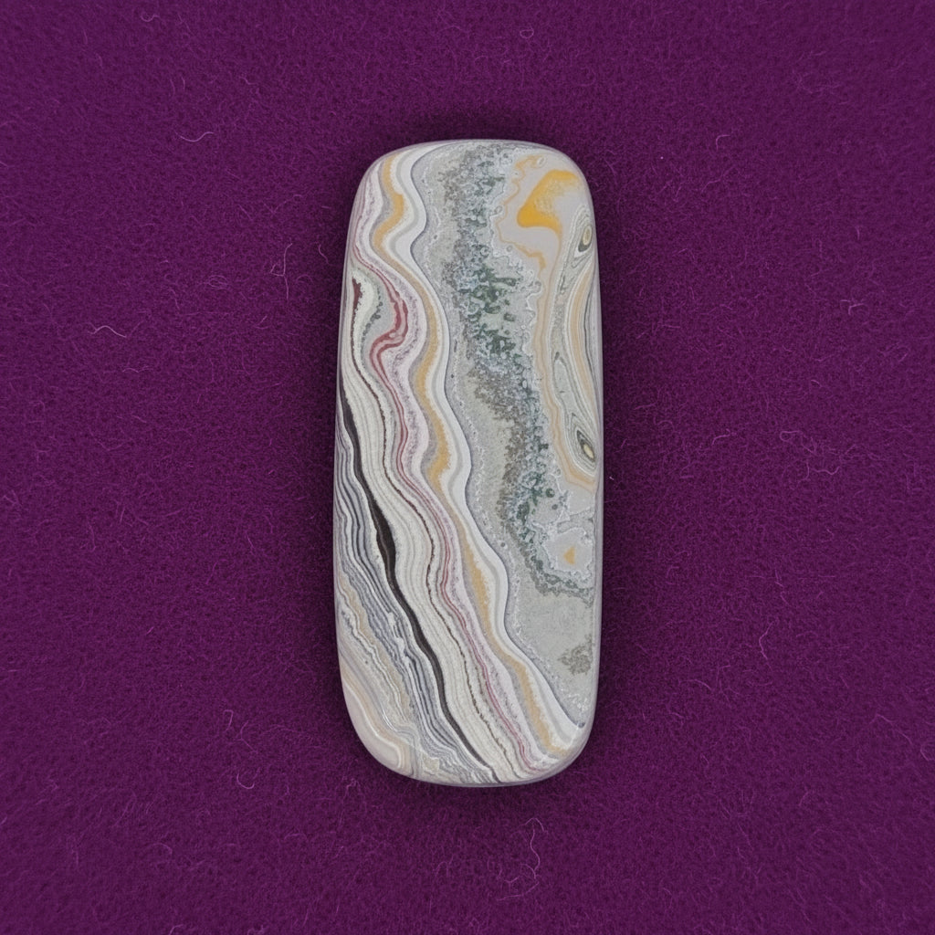 Heil Garbage Truck Fordite Free Form Caboceon, Heil (Milwaukee, WI) 41x17x3mm, 15.85ct