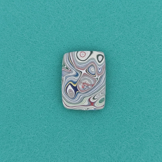 Heil Garbage Truck Fordite Free Form Caboceon, Heil (Milwaukee, WI) 22x16x3mm, 6.38ct