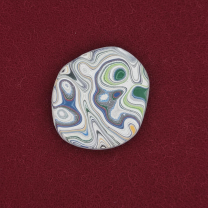 Heil Garbage Truck Fordite Free Form Caboceon, Heil (Milwaukee, WI) 28x25x3mm, 13.88ct