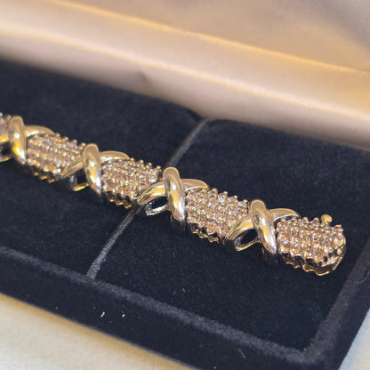 4cttw natural diamond "Hugs and Kisses" tennis bracelet, 10k Yellow Gold 28.13gr, 20cm long