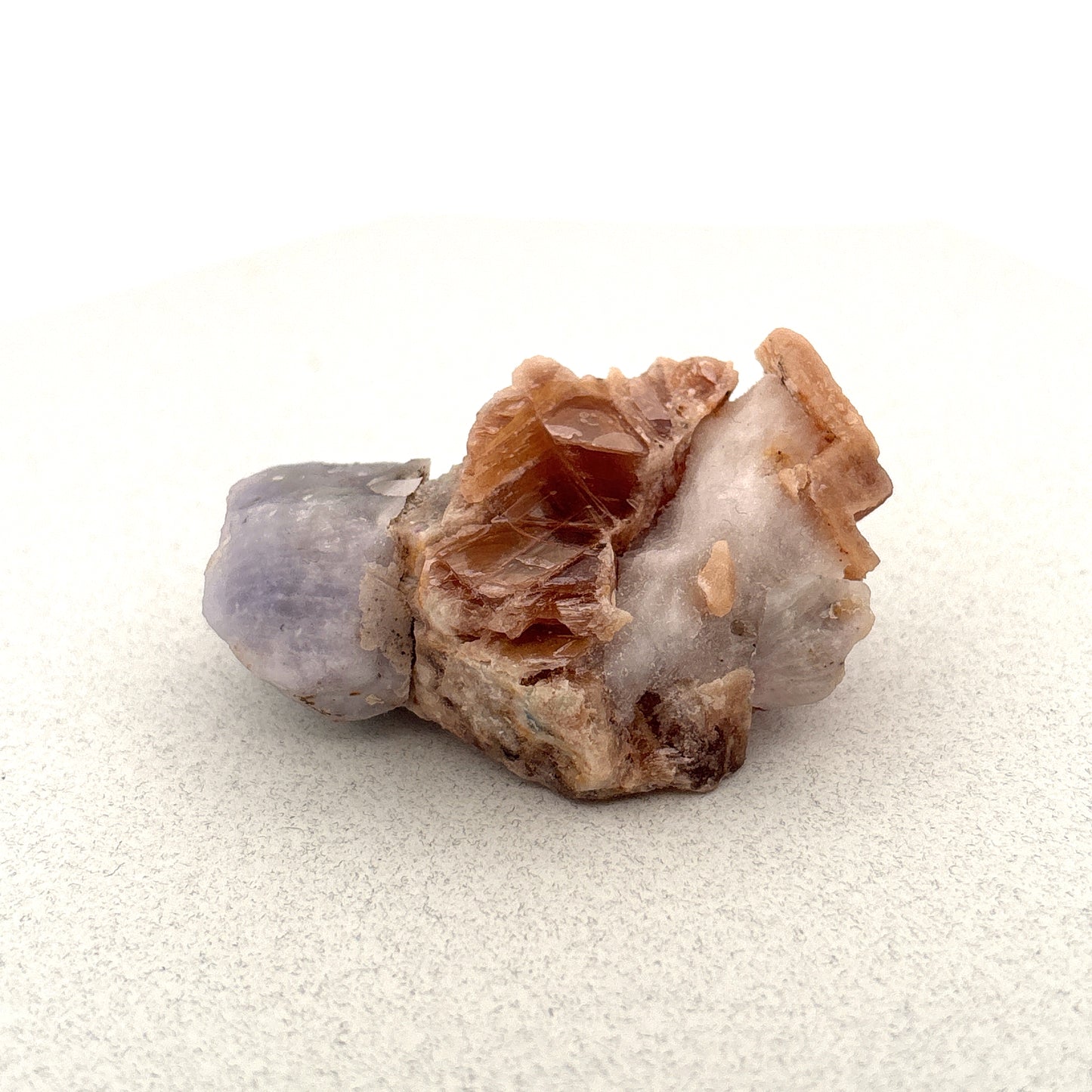 Fluorescent Hackmanite & Calcite on Quartz, 46.69gr, 53x35x23mm