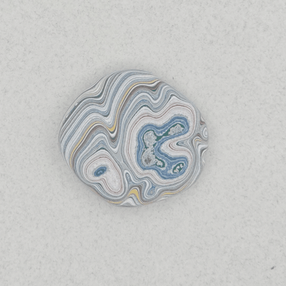 Heil Garbage Truck Fordite Free Form Caboceon, Heil (Milwaukee, WI) 28x25x3mm, 13.88ct