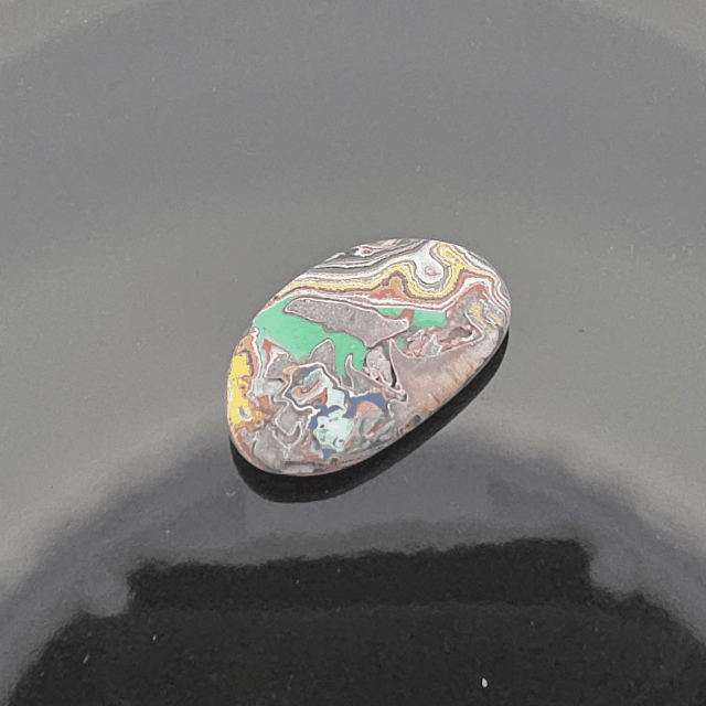 Cadilite, Cadilac Ranch "Fordite" Free From Cabocheon, Amarillo, Texas, 10.75ct 32x20x4mm