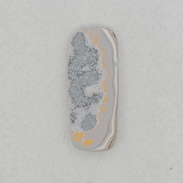 Heil Garbage Truck Fordite Free Form Caboceon, Heil (Milwaukee, WI) 41x17x3mm, 15.85ct