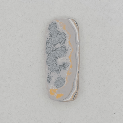 Heil Garbage Truck Fordite Free Form Caboceon, Heil (Milwaukee, WI) 41x17x3mm, 15.85ct